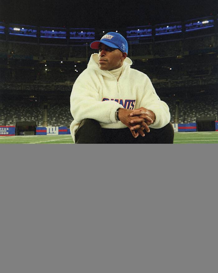 Tiki Barber models New York Giants apparel.